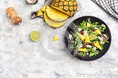 Vitamin salad of leaves of pineapple, blue cheese. almond, banner, menu recipe place for text, top view Stock Photo