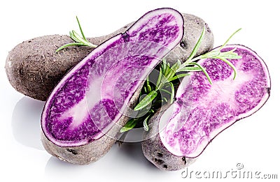 Vitolette noir or purple potato. On a wooden table. Stock Photo