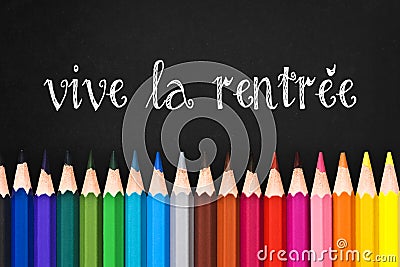 Vive la rentree (meaning Back to school) written on black chalkboard background Stock Photo