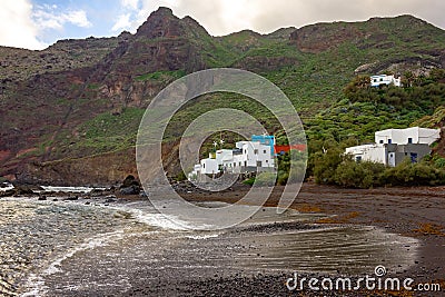 Volcanic Black Beach and Colorful Fishing Houses, Roque Bermejo, Tenerife, Canary Islands, Spain Stock Photo