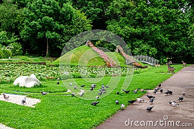 Vivid landscape in Alexandru Buia Botanical Garden from Craiova in Dolj county, Romania, with lake, waterlillies and large green Stock Photo