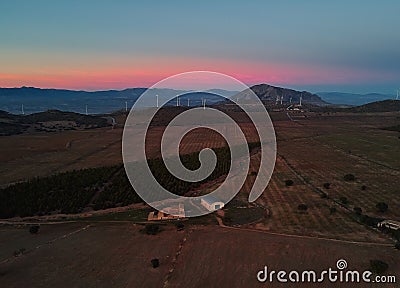 Vivid pink sunset over farmland cultivated land Stock Photo