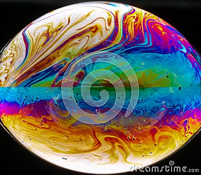 Vivid rainbow colours of a Macro soap bubbles creating psychedelic patterns Stock Photo