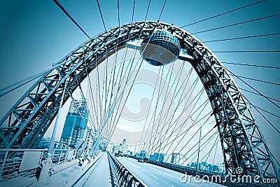 Vivid red suspension bridge Stock Photo