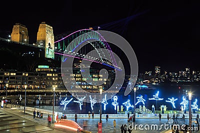 `Vivid Sydney` lighting displays. Sydney Harbour Bridge and Campbell`s Cove Editorial Stock Photo