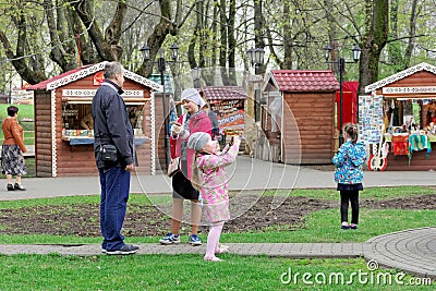 Vladimir, Russia. - May 06.2018. Tourists pilgrims and their children walk in the park Oaks. Editorial Stock Photo