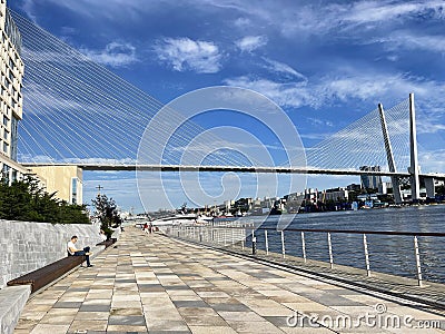 Vladivostok, Russia, August, 31, 2023. Korabelnaya embankment, Golden Bridge, Grand Hotel and SPA in Vladivostok Editorial Stock Photo