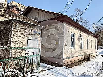 Vladivostok, Russia, February, 29,2020. Old wooden house in the center of Vladivostok at 25 a Pushkinskaya street Editorial Stock Photo