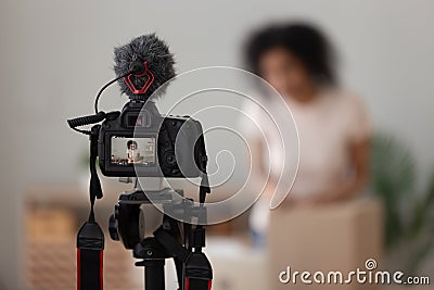 Vlogger using digital camera close up, recording parcel unboxing Stock Photo