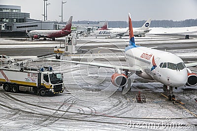 Vnukovo International aipport in Moscow. The airline company Azimuth in winter at Vnukovo airport, anti-icing aircraft Editorial Stock Photo