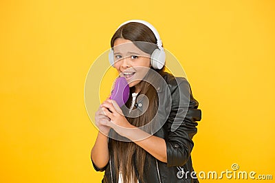 Vocal classes. Becoming singer. Recording studio. Beautiful voice. Developing voice. Voice synthesis. Small girl listen Stock Photo