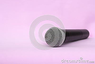 Vocal silver microphone wireless for audio recordings, karaoke on pink background Stock Photo