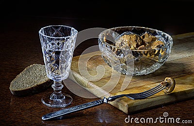 Vodka in glass with salted mushrooms Stock Photo