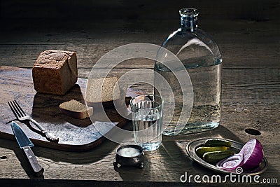 Vodka, vegetables and bread and salt on the table Stock Photo