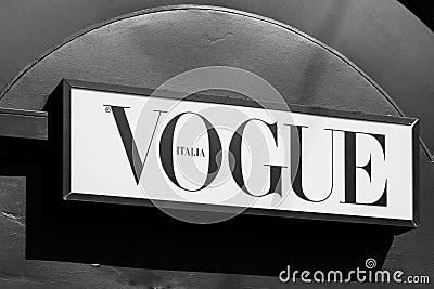 Vogue brand logo sign on a newspaper kiosk. Vogue is monthly fashion and lifestyle magazine covering many topics Editorial Stock Photo