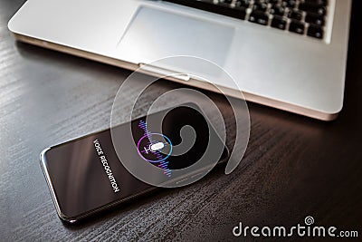 Voice recognition AI sound speech detect and deep learning search concept. Siri application with microphone icon smartphone screen Stock Photo