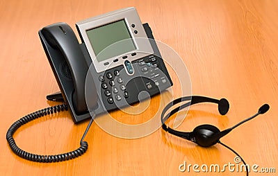 VoIP phone with a headset Stock Photo