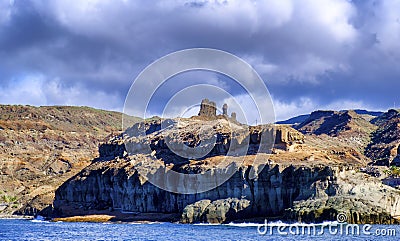 Volcanic coastline in Puerto Rico , Gran Canaria from the ocean Stock Photo