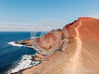 Volcanic crater with blue ocean near La Santa, Lanzarote. Aerial view Stock Photo