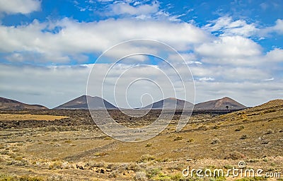 Volcanic hills in the desert landscape of the island of Lanzarote, which is a protected area of UNESCO Stock Photo