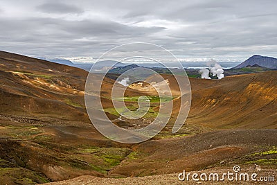 Volcanic Landscape of Krafla area in northern Iceland and Myvarn lake and wetland at background Stock Photo