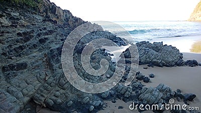 Volcanic rock on the beach of Anse Tillet on Basse-Terre in Guadeloupe Stock Photo