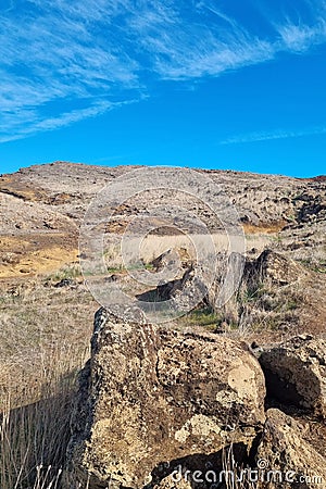 Volcanic rocks on the island of Madeira. Mountain slopes. Sunny island. Stock Photo