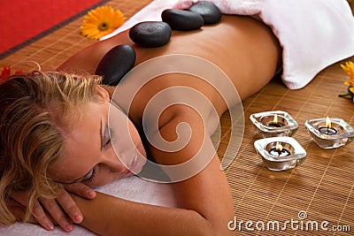 Volcanic stone massage at the spa Stock Photo