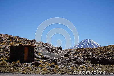 Volcano blue sky small house mountain Stock Photo