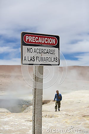 Volcano danger warning sign post in Solar de Manana geyser, Boli Stock Photo