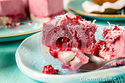 Volcano mini cake with flowing lava from raspberry jam. Close-up, selective focus Stock Photo