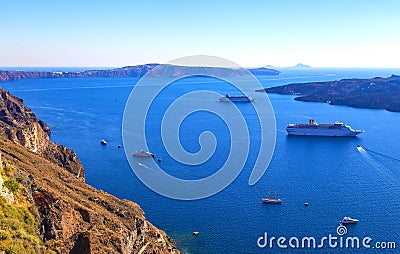 Volcano of Santorini island with ferry, Greece. Travel destination background, caldera view of Santorini nature. Ships and boats Stock Photo