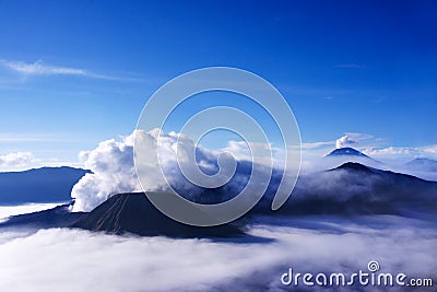 Volcanoes seen at a distance from Mount Penanjakan Indonesia. Stock Photo