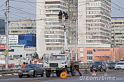 Workers on the crane install and decorate the Astrakhan bridge with led light in Volgograd Editorial Stock Photo