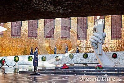 Volgograd, Russia - October 18, 2019: Hall of Military Glory in Memorial complex Mamayev Kurgan. Sculpture of hand holding torch Editorial Stock Photo