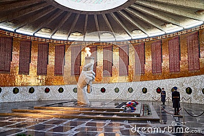 Volgograd, Russia - October 18, 2019: Hall of Military Glory in Memorial complex Mamayev Kurgan. Sculpture of hand holding torch Editorial Stock Photo