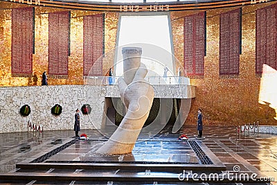 Volgograd, Russia - October 18, 2019: Hall of Military Glory in Memorial complex Mamayev Kurgan. Sculpture of hand holding torch Editorial Stock Photo
