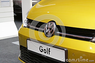 Volkswagen car manufacturer commercial emblem logos made from chrome metal fix at the car. Editorial Stock Photo