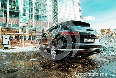 Volkswagen Touareg car on urban parking, rear side view Editorial Stock Photo