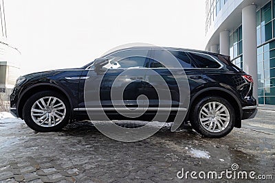 Volkswagen Touareg car on urban parking, side view Editorial Stock Photo