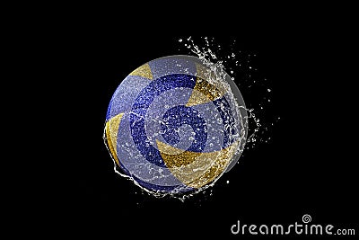 Volleyball ball flying in water drops and splashes isolated on black background Stock Photo