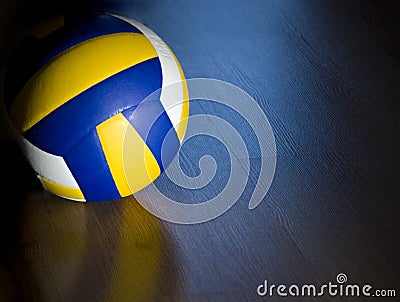 Volleyball on hardwood floor Stock Photo