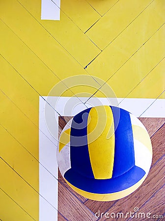 Volleyball on hardwood floor Stock Photo