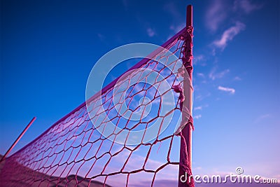 Volleyball net stands tall in vibrant purple, ready for action Stock Photo