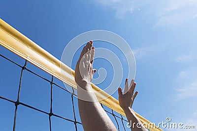 Volleyball spike hand block over net. close-up reach for ball Stock Photo