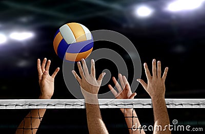 Volleyball spike hand block over the net Stock Photo