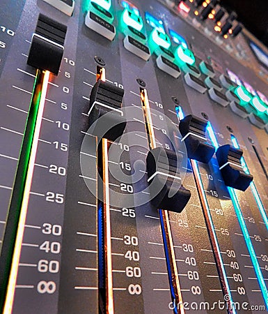 Volume faders on a digital sound board Stock Photo