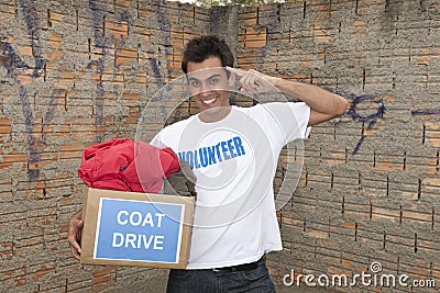 Volunteer with coat drive donation box Stock Photo