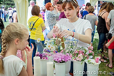 Volunteer at floristic workshop Editorial Stock Photo