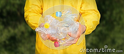 Volunteer hands holding bottle plastic garbage. Environment clean up park cleaning trash nature. Volunteer cleaning Stock Photo